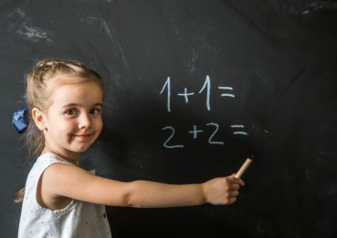 girl-schoolgirl-near-blackboard_169016-2131